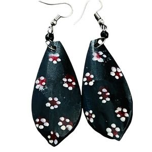 Handmade by African artist, horn earrings. Teardrop with flowers